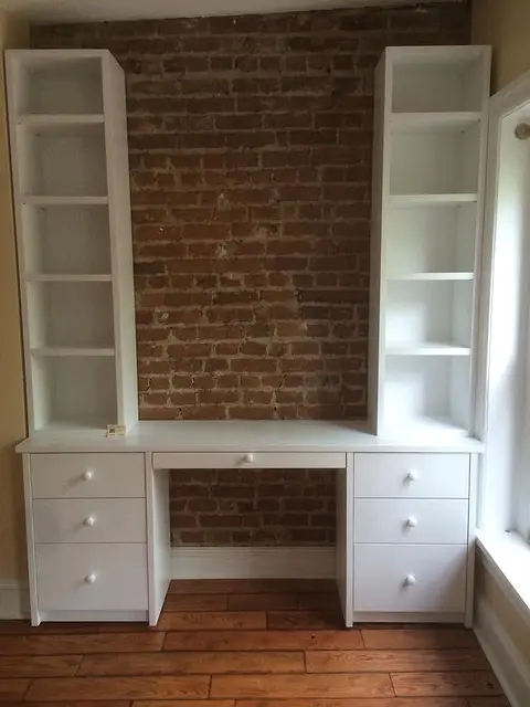 Desk between bookcases