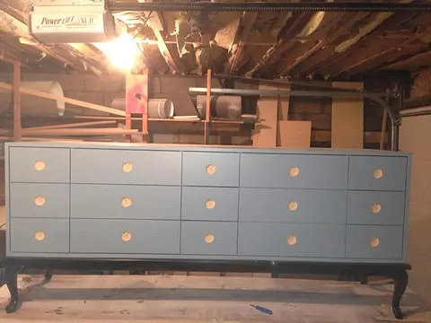 Painted dresser with brass cups