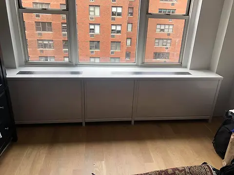 Radiator cover under the window