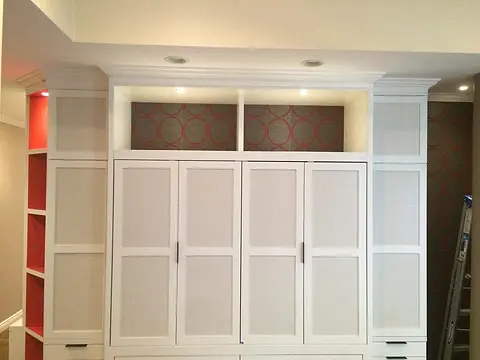 Wall unit with color-backed shelves